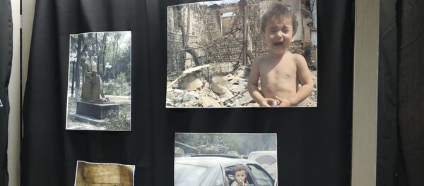 В Цхинвале открылась выставка в память жертв войны августа 2008 года В Цхинвале открылась выставка в память жертв войны августа 2008 года - Sputnik Южная Осетия