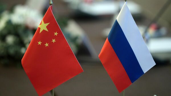 Флаги Китая и России. Архивное фото - Sputnik Южная Осетия