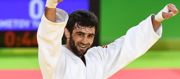 Беслан Мудранов, победивший в финальном поединке летних Олимпийских игр Беслан Мудранов, победивший в финальном поединке летних Олимпийских игр - Sputnik Южная Осетия