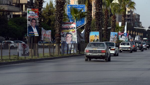 Предвыборные плакаты кандидатов в парламент Сирии - Sputnik Южная Осетия