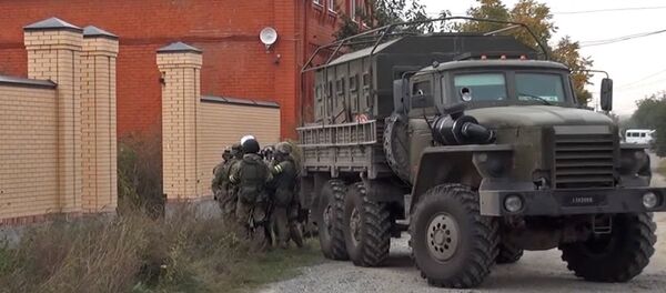 Сотрудники правоохранительных органов во время спецоперации Сотрудники правоохранительных органов во время спецоперации - Sputnik Южная Осетия