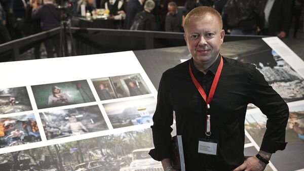 Специальный фотокорреспондент МИА Россия сегодня Валерий Мельников на открытии выставки победителей World Press Photo в Амстердаме. - Sputnik Южная Осетия