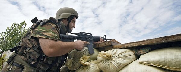Грузинские военнослужащие во время войны в Южной Осетии Грузинские военнослужащие во время войны в Южной Осетии - Sputnik Южная Осетия