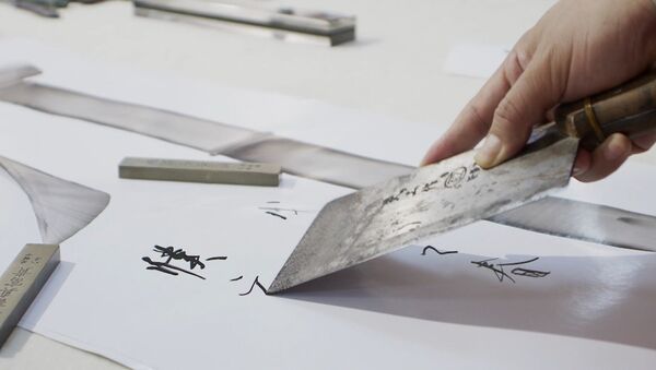 Китайский каллиграф рисует иероглифы поварскими ножами - Sputnik Южная Осетия