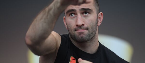 Мурат Гассиев и Александр Усик - открытая тренировка в Москве Мурат Гассиев и Александр Усик - открытая тренировка в Москве - Sputnik Хуссар Ирыстон