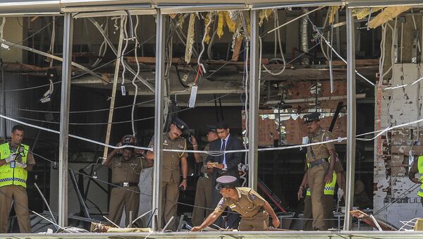 Полицейские на месте взрыва в Коломбо, Шри-Ланка - Sputnik Южная Осетия