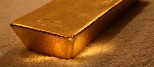 Слиток золота, архивное фото Слиток золота, архивное фото - Sputnik Южная Осетия