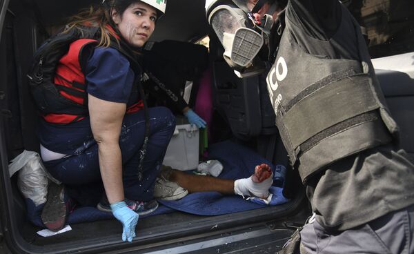 Раненый в столкновении с Национальной гвардией Венесуэлы в Альтамире, районе Каракаса - Sputnik Южная Осетия