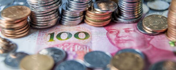 Монеты и банкноты китайских юаней  Монеты и банкноты китайских юаней  - Sputnik Южная Осетия