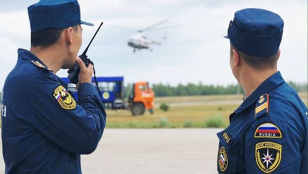 Сотрудники МЧС РФ прибыли для ликвидации лесных пожаров в Якутии - Sputnik Южная Осетия