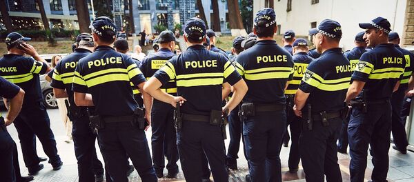 Сотрудники полиции во время акции протеста в Тбилиси Сотрудники полиции во время акции протеста в Тбилиси - Sputnik Южная Осетия